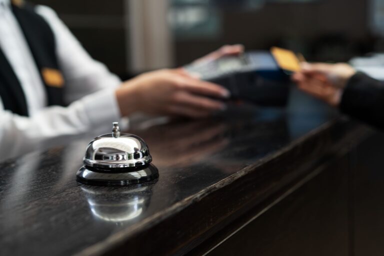 Close up of customer making payment in hotel