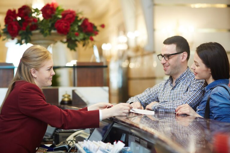 Couple check in on  hotel reception